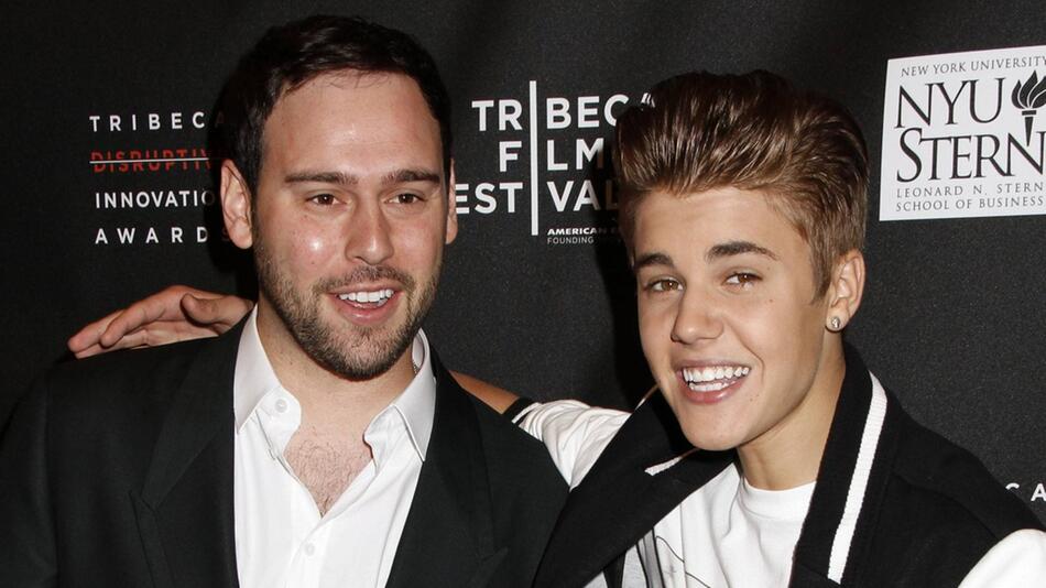 Justin Bieber (r.) und Scooter Braun auf einem Event im Jahr 2012.