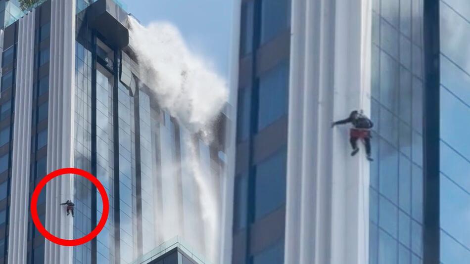 Wasser stürzt vom Dach – Fensterputzer hängt bei Erdbeben an Hochhaus