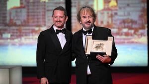 Elijah Wood (li.) hat Peter Jackson eine Ehrenpalme in Cannes verliehen.