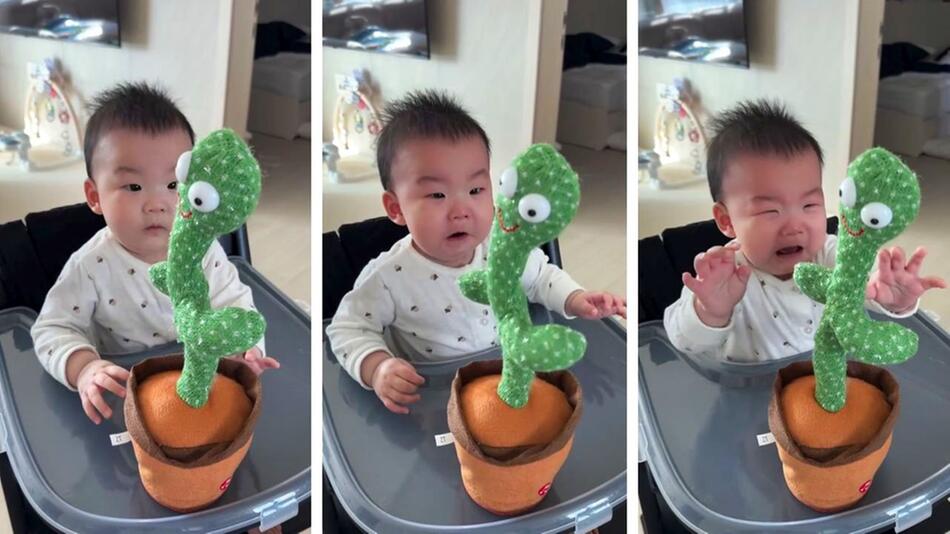 Baby mit Kaktus-Spielzeug